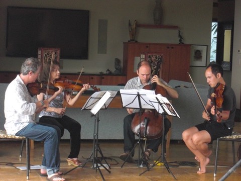 Ebb and Flow musicians rehearse before a performance